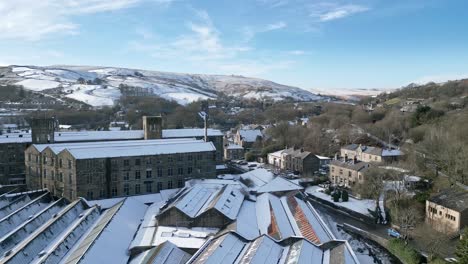 Cold-Snowy-Winter-Cinematic-aerial-view-cityscape-townscape-with-snow-covered-roof-tops-Panorama-4K-footage-of-the-town-of-Marsden-West-Yorkshire,-Endland
