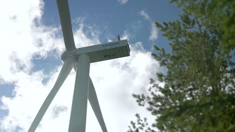 Low-angle-view-of-a-wind-turbine-from-Vestas-company,-sustainable-energy-concept