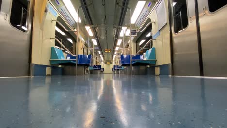 Empty-subway-train-in-movement-as-lights-pass-by---covid-days,-low-camera-angle-on-the-floor---Sao-Paulo-Brazil