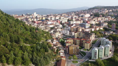 Flying-right-wide-shot-of-Campobasso-city-with-hill-and-old-town-in-the-foreground