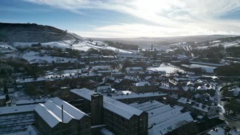 Cold-Snowy-Winter-Cinematic-aerial-view-cityscape-townscape-with-snow-covered-roof-tops-Panorama-4K-Marsden-Village-West-Yorkshire,-Endland