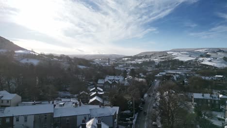 Winter-Cinematic-aerial-view-cityscape-townscape-with-snow-covered-roof-tops-Panorama-4K-Marsden-Village-West-Yorkshire,-Endland