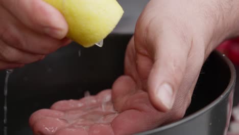 Chef-drains-a-lemon-to-prepare-cebiche
