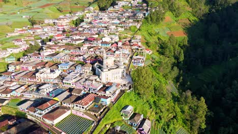 Aerial-view-of-Indonesian-countryside-on-the-slope-of-mountain-with-a-Mosque-built-on-it
