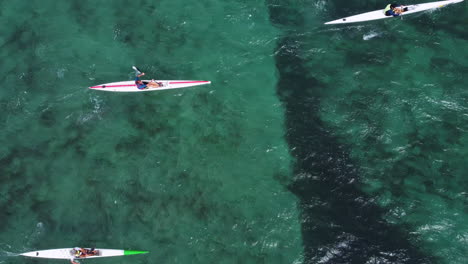Overhead-shot-of-a-surf-ski-race-competitor-on-the-blue-water