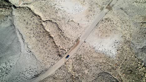 Drone-shot-of-a-car-moving-toward-Cotton-Wood-Canyon-Road