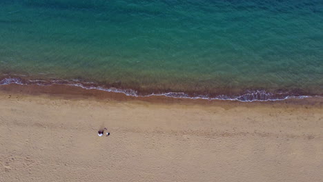 Top-view-of-beautiful-beach-with-one-person-on-it