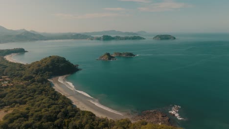 Turquoise-Ocean-And-Scenic-Shore-Of-A-Beach-In-Guanacaste,-Costa-Rica---aerial-drone-shot