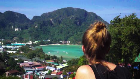 View-Behind-Female-Tourist-Overlooking-Phi-Phi-Bay-From-Summit-Viewpoint-In-Vietnam
