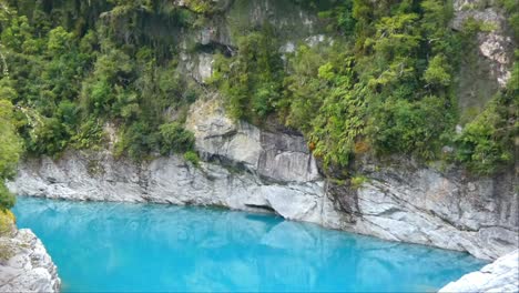 Close-up-of-spectacular-turquoise-colored-water-of-river-gorge-as-it-passes-through-granite-rocks---Hokitika-River-Gorge-Walk,-West-Coast