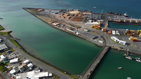 South-port-in-Bluff,-New-Zealand-with-cargo-containers-and-ships-in-drone-view