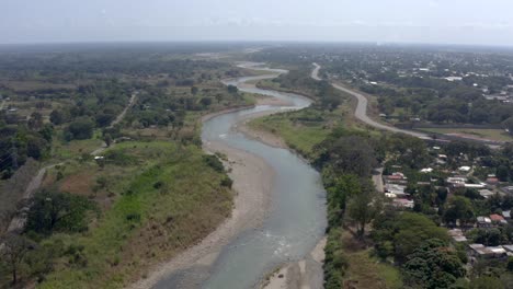 Aerial-view-from-drone-over-river-near-the-village