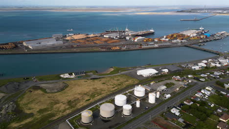 Cargo-port-in-Bluff,-New-Zealand-with-loading-dock-for-timber-export,-aerial-view