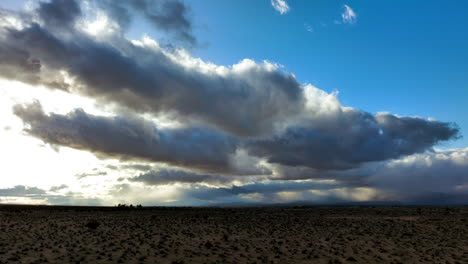 Storm-clouds-crossing-the-Mojave-Desert-basin---aerial-hyper-lapse