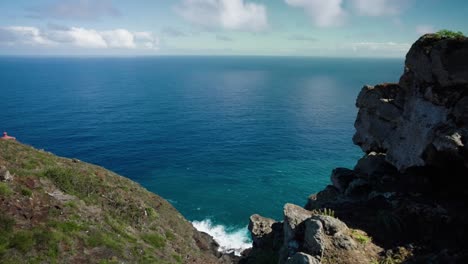 Hawaiian-cliff-Timelapse-overlooking-Pacific-Ocean-on-sunny-day-with-clouds
