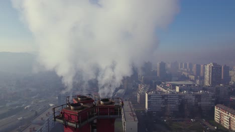 Heavy-smoke-coming-out-of-a-chimney-in-a-polluted-city