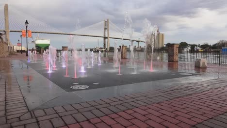 Red-bricks-and-the-fountain-emittting-colorful-water-at-the-Plant-Riverside-District