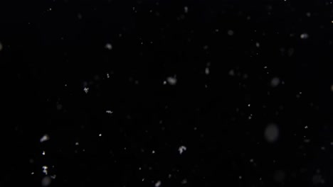 slow-motion-flurry-of-snow-in-a-pitch-black-January-night