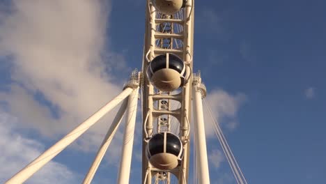 low-angle-of-Ferris-wheel-cabins-at-Villa-Lobos-Park-in-Sao-Paulo,-Brazil