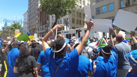An-energetic-woman-chants-at-police-while-protesting-Eskom's-load-shedding-and-rolling-blackouts