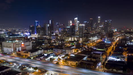 Drone-hyperlapse-of-the-south-side-of-Downtown-Los-Angeles-Skyline-at-night