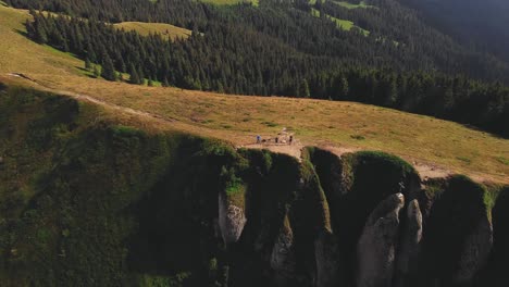 Forward-moving-drone-shot-of-the-Piatra-Mare-peak-in-the-Romanian-Carpathian-Mountains-on-a-sunny-summer-day