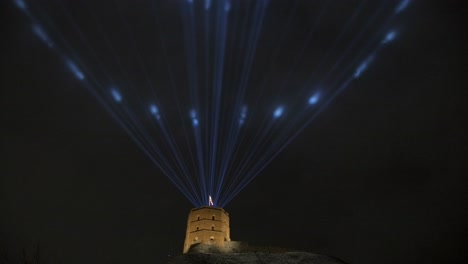 Medieval-castle-with-laser-lights-in-the-dark-sky