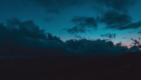 Aerial-timelapse-view-of-dark-clouds-during-sunset