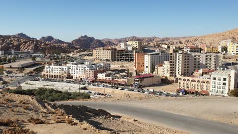 A-view-of-Wadi-Musa-town-in-Jordan,-the-popular-tourism-main-entrance-to-the-ancient-city-of-Petra,-with-hotels,-shops,-cafes-and-restaurants
