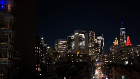 Manhattan-Skyline-and-Night-Traffic,-Lights-on-Skyscrapers-and-Streets,-New-York-USA