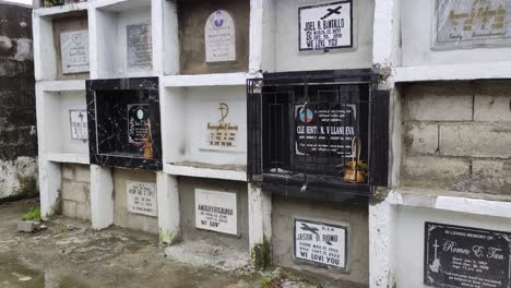 A-panning-shot-of-stacked-graves-at-the-Handumanan-Public-Cemetery-in-Bacolod-City,-Philippines