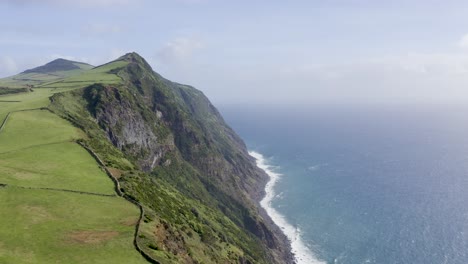 Drone-footage-of-dramatic-cliffs-over-the-Atlantic-ocean-in-Sao-Jorge-island,-Azores,-Portugal