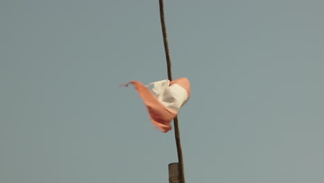 Close-up-of-a-tattered-Peruvian-flag-waving-in-the-wind