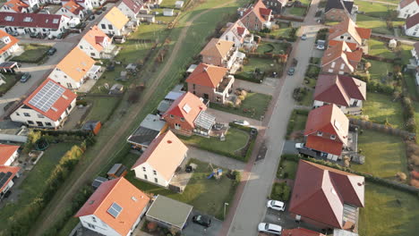Suburban-residential-area-with-uniform-single-family-houses-with-gardens-in-a-small-town-in-Germany