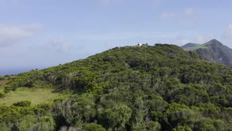 Drone-footage-of-Vigia-da-Baleia-viewpoint,-surrounded-by-endemic-vegetation,-revealing-agricultural-fields-in-Sao-Jorge-island,-Azores,-Portugal