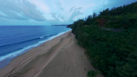 Cinematic-drone-shot-of-amazing-white-sand-beach-and-lush-green-foliage-with-blue-waters