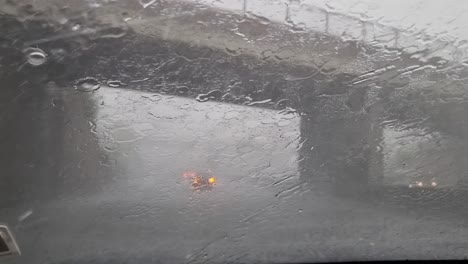 Heavy-rain,-hail-and-flooding-driving-on-the-Auckland-highway-in-New-Zealand