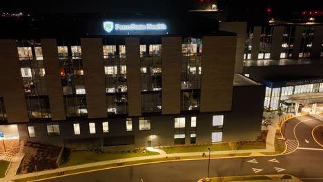 Aerial-hyperlapse-of-Penn-State-Health-hospital-in-Lancaster,-PA-at-night