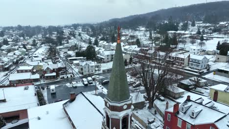Aerial-orbit-around-church-steeple-in-small-town-in-America
