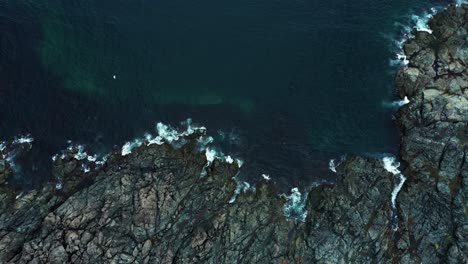 Ocean-Waves-Filmed-from-above-against-a-rocky-coastline---Nova-Scotia