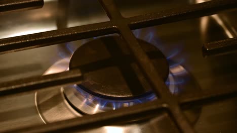 Stove-top-with-burner-of-a-gas-stove-with-flame-visible