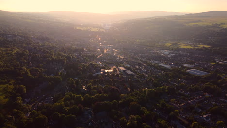 Establishing-Drone-Shot-into-the-Sun-of-Rural-Town-Ilkley-into-the-Sun-at-Golden-Hour-Sunset-Dusk-West-Yorkshire-UK
