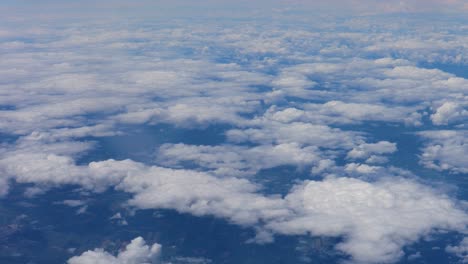 View-from-aircraft-of-lower-cloud-deck-near-built-up-area