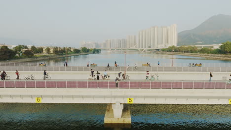 Areal-shot-of-people-walking-and-biking-over-two-beautiful-bridges