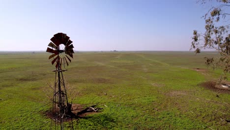 old-wind-vane-fly-by-on-farm-outside-of-merced-california