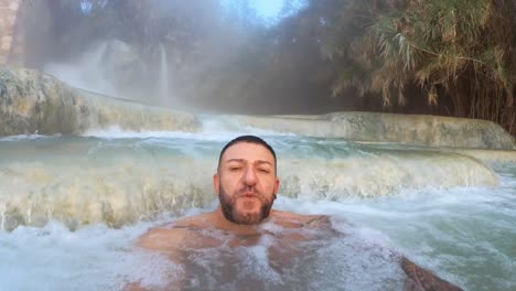 man-bathing-in-the-baths-of-saturnia