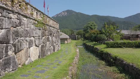 Old-irrigation-ditch,-stone-wall-around-historic-Naganeupseong-Folk-Village