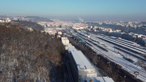 Prague-Smichov-Railway-Station-and-traffic,-aerial-drone-winter-view,-city-background,-Czech-Republic