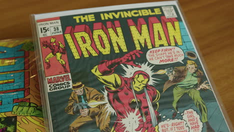Close-Up-Tilt-Down-of-a-The-Invincible-Iron-Man-Comic-Book