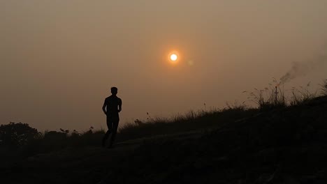 CInematic-establisher-view-of-silhouetted-runner,-high-contrast,-sunset